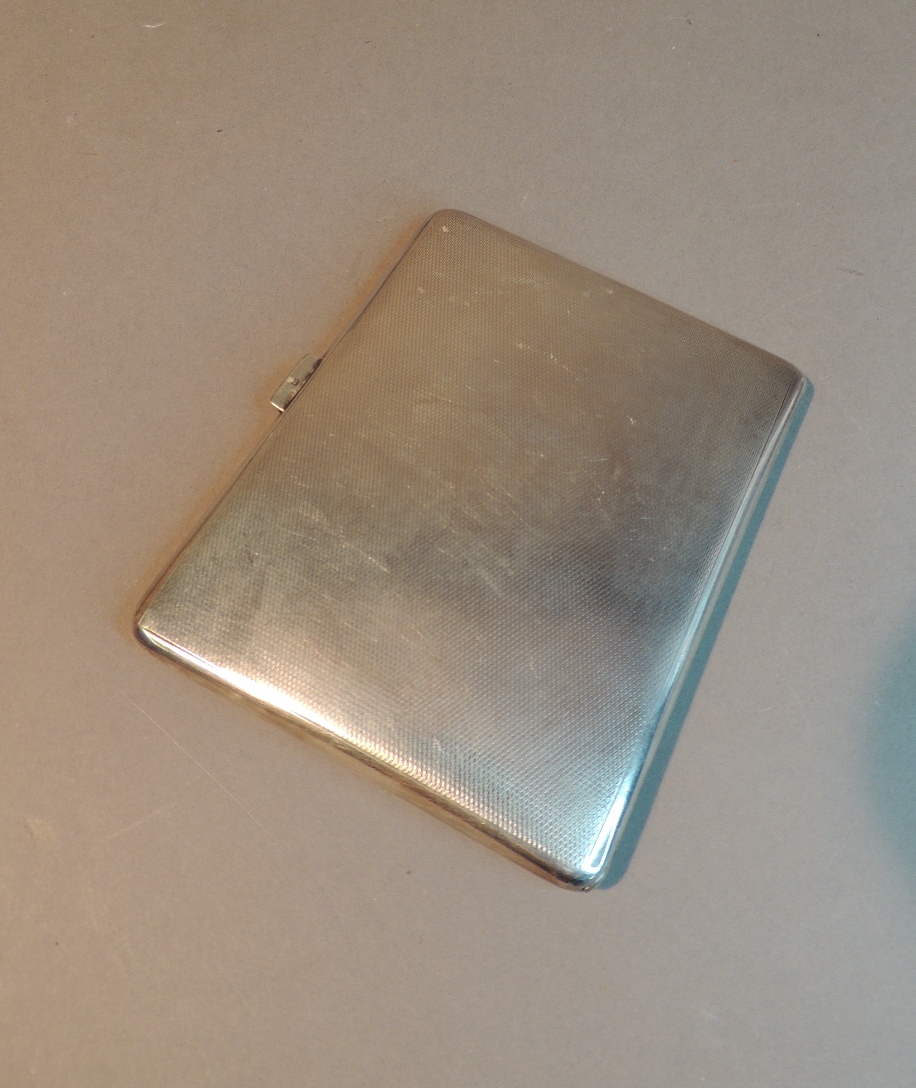 A George VI engine turned cigarette case, the front with rectangular cartouche with crest and - Image 3 of 5