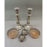 A pair of Victorian silver plate on copper table candle sticks in Regency style, foliate wrapped