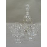 A glass decanter and six glasses of pulled decoration, the decanter 26cm high