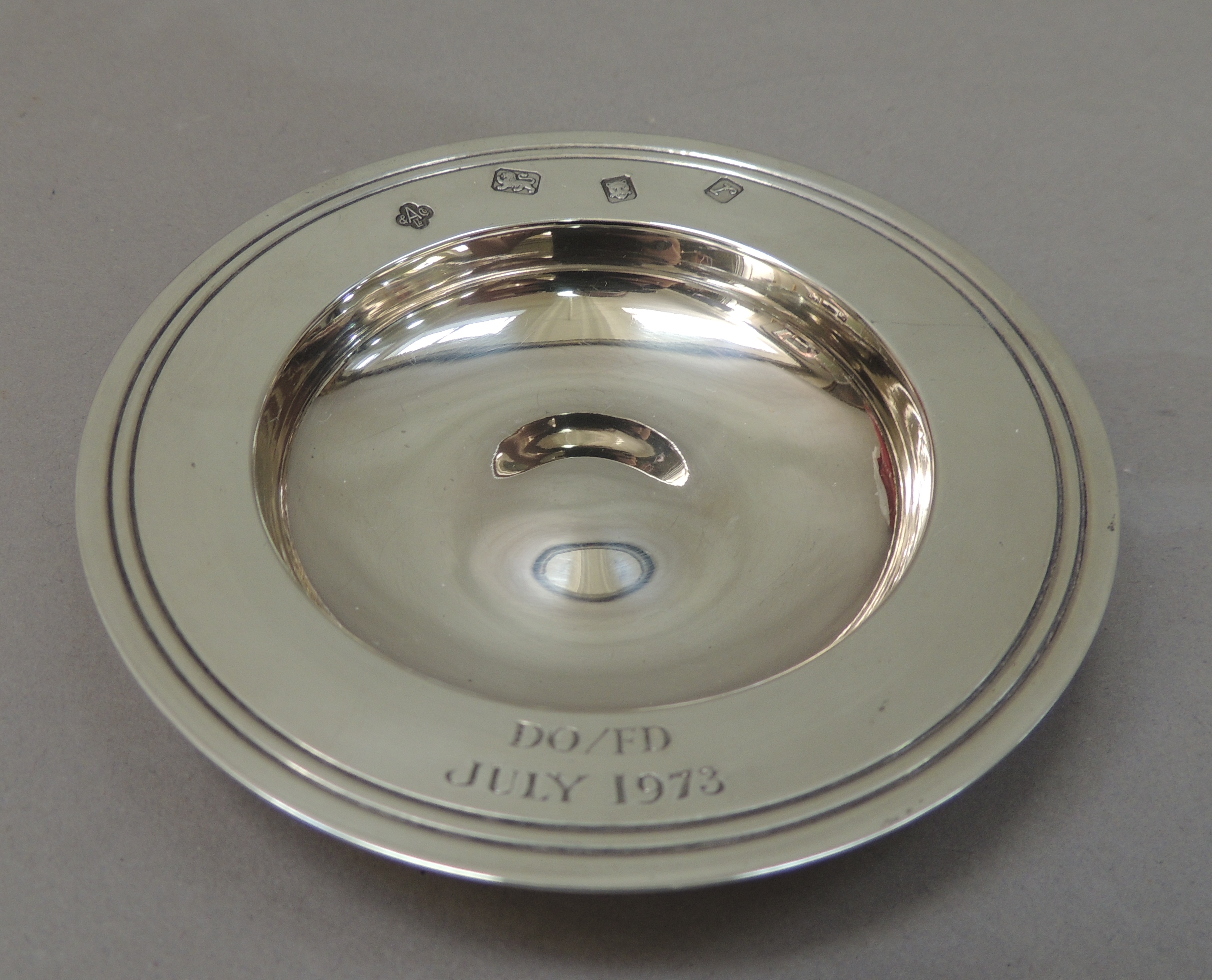 A reproduction silver armada dish, the rim engraved and dated July 1973 by Asprey and Co London - Image 2 of 2
