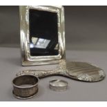 A silver photograph frame with reeded edge and ribbon slip, 20cm by 15cm; together with a silver