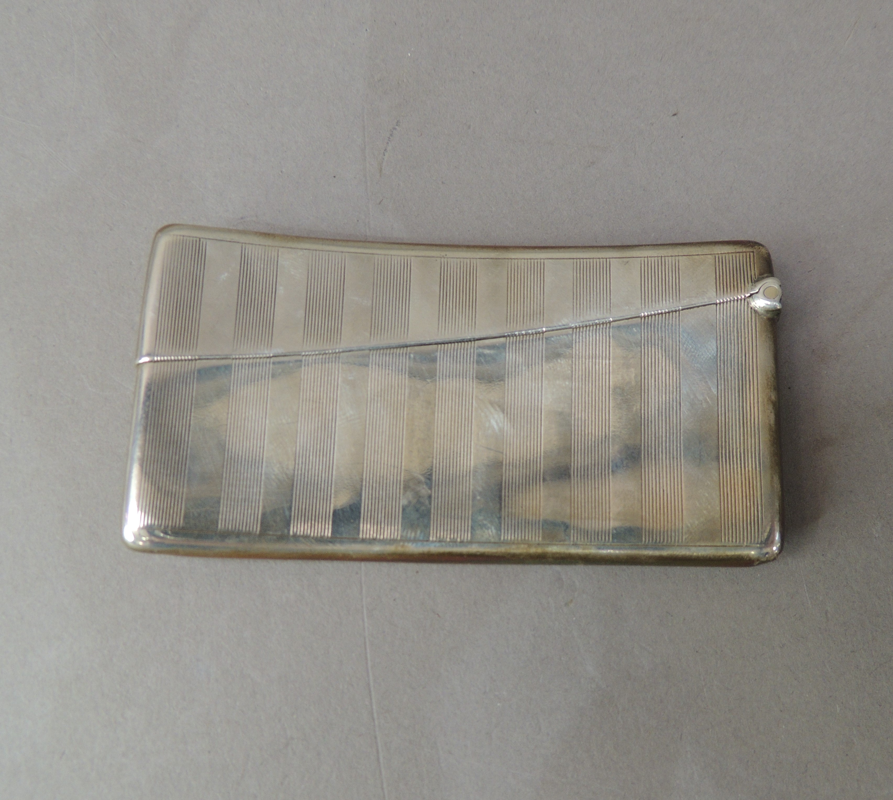 A silver calling card case, engine turned with vacant circular cartouche, 8cm wide, indistinct - Image 2 of 2