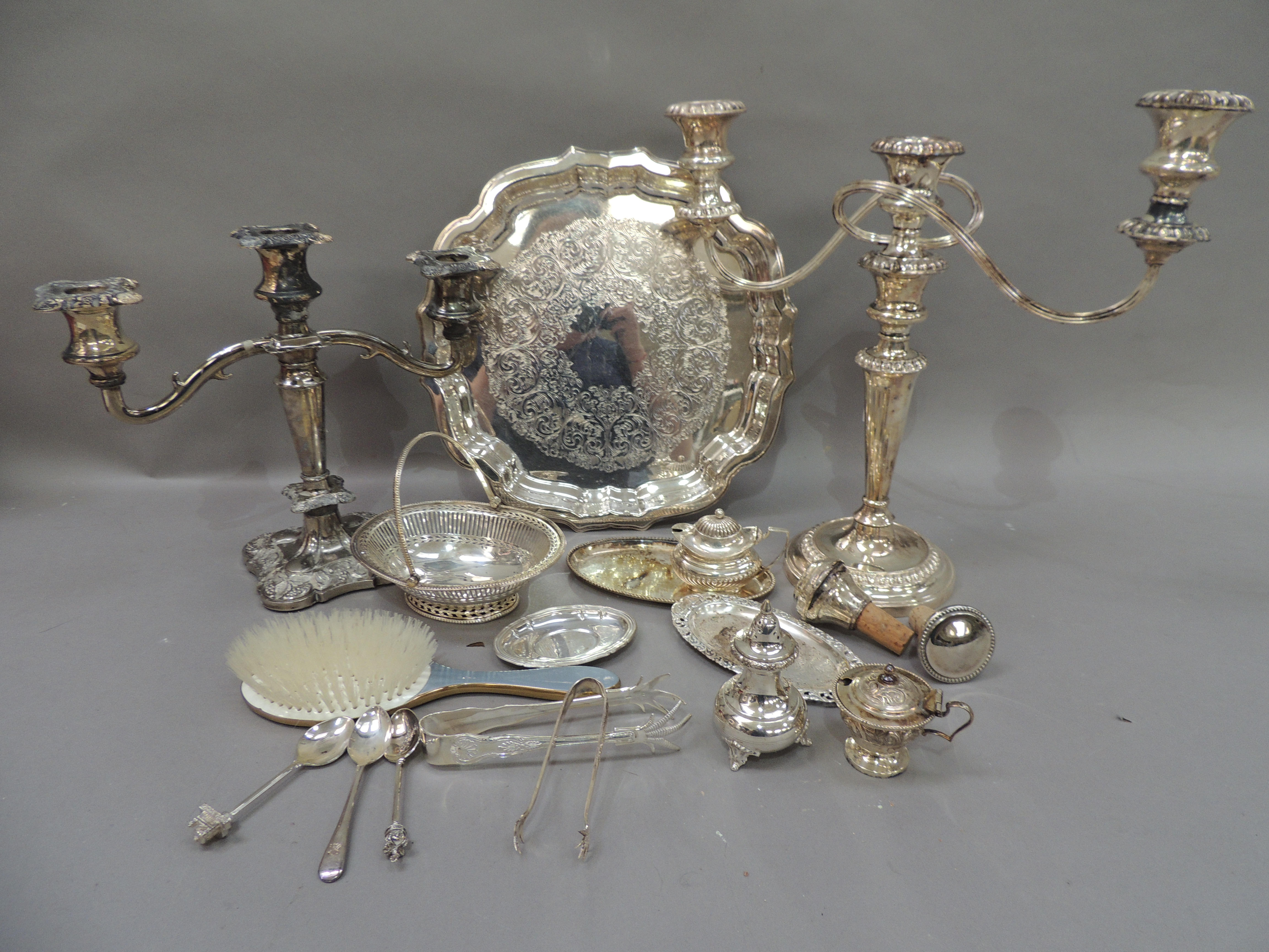 A quantity of miscellaneous silver plated ware to include two branch candelabra, salver, swing