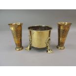 An Art Nouveau brass planter, the cylindrical body raised on three applied, pierced cast legs in Art