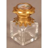 A 19th century mounted glass scent bottle, square outline, the hinged lid inset with a circular