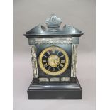 A Victorian marble and black slate mantel clock, the architectural pediment, the dial having a black