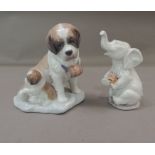 A Lladro figure of a St Bernard and pup, 14cm high; together with a Ladro figure of a seated