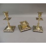 A Victorian brass desk set comprising well and pair of candlesticks, the square ink well with