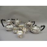 A quantity of silver plated items including two four piece tea services