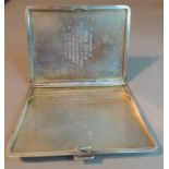 A George VI engine turned cigarette case, the front with rectangular cartouche with crest and