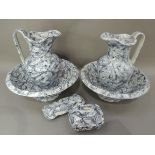 A Victorian six piece toilet set of grey marbled decoration comprising two water jugs, two bowls