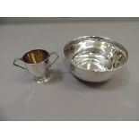 A silver sugar bowl, plain, 11cm diameter, by Mappin and Webb, Birmingham, 1939; together with a