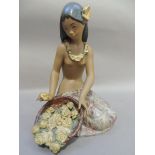 A Lladro porcelain colour figure of a semi naked young girl with basket of flowers, kneeling, 27cm