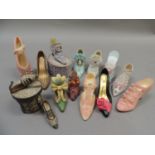 A quantity of miniature resin shoes, two boxes: shoes of distinction and another box: just the right