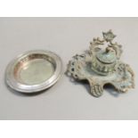 A Victorian gilt metal inkstand together with a silver plated dish engraved with crest to the centre