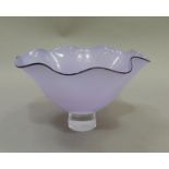A Gillies Jones lilac glass Rosedale bowl, with black rim line and clear glass pedestal foot, 20.5cm