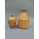 Two spalted beech turned vases, of ovoid form with fluted collar and everted rim, 19.5cm and