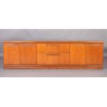 A Meredew suite of teak sideboard having two drawers to the centre and a two door cupboard to either