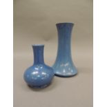 A William Moorcroft 'Powder Blue' vase, compressed circular with funnel neck, green painted