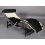 A Le Corbusier LC4 style chaise longue upholstered in black and white cow hide wth black leather