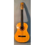 An Admira Almeria classical guitar with Oregon pine top and Sapelli back, ebonized finger plate