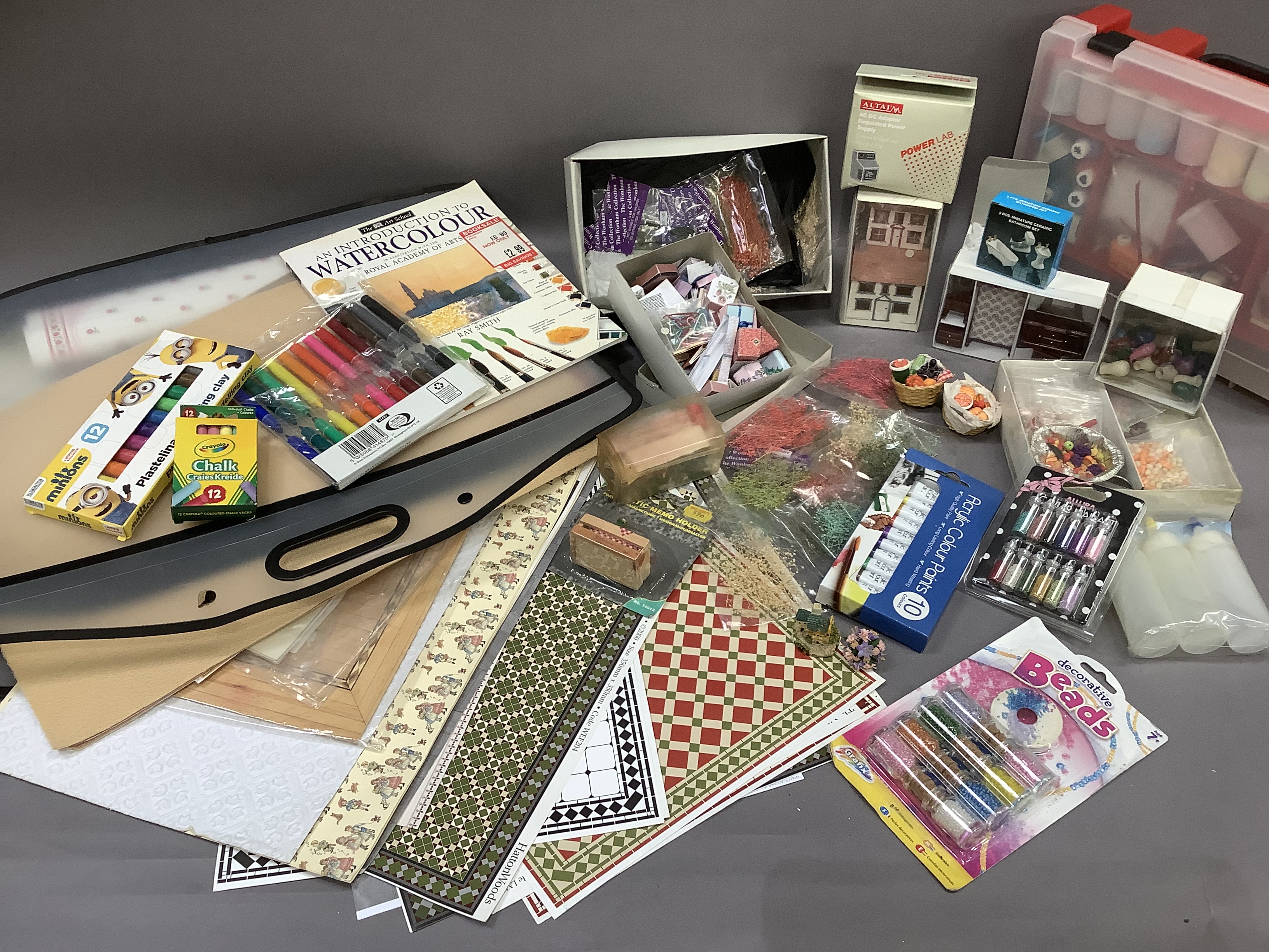 A quantity of craft material to include watercolours, modelling accessories, glitter, beads, paints,