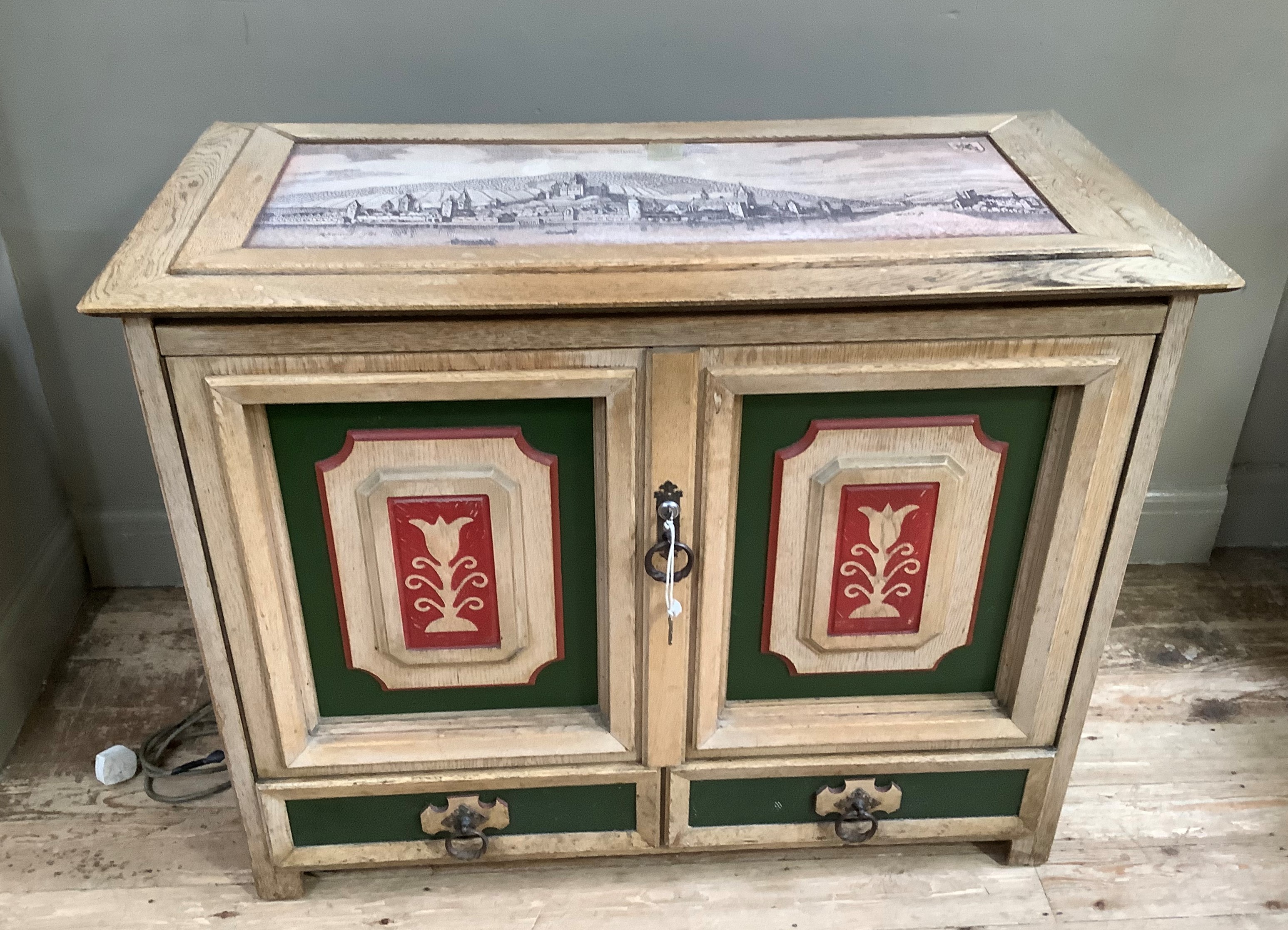 An NSM Consul 160 juke box, in oak cabinet, the rectangular top inset with a panel of a rhine