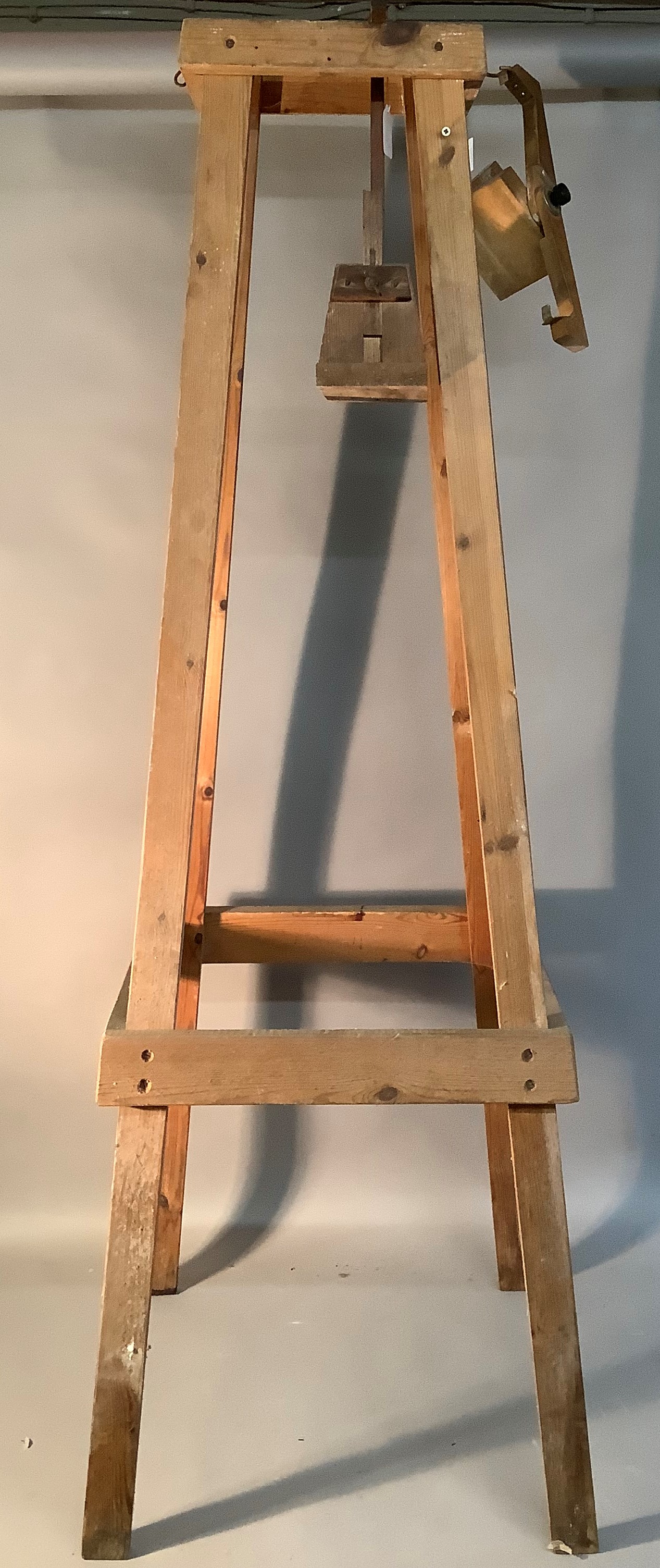 A clock stand for long case clock movements floor standing; together with a wall mounted rig for