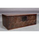 A LATE 17TH CENTURY OAK BIBLE BOX, the plain hinged lid above a front carved with interlaced arches,