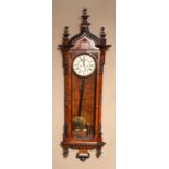 A MID 19TH CENTURY WALNUT VENEERED VIENNA WALL CLOCK with moulded swept cornice and three compressed