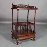 A VICTORIAN ROSEWOOD MUSIC CANTERBURY having a three quarter fretwork gallery above three