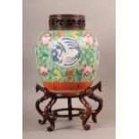 A CHINESE PORCELAIN FAMILLE ROSE JAR, of baluster form, decorated to the body with crane filled