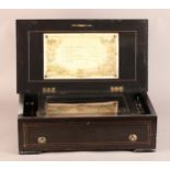 A LATE 19TH CENTURY SWISS MUSICAL BOX PLAYING SIX AIRS, the ebonised case with rosewood veneered