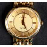 AN OMEGA LADY'S DE VILLE WRISTWATCH in 18ct gold case No. 56816799 on an integral gate type