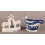 A LEEDS POTTERY SAUCEBOAT, transfer printed in underglaze blue with a willow pattern, 19cm wide,