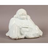 A CHINESE BLANC DE CHINE FIGURE OF A SEATED BUDDHA, 14cm high