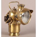 A JOS LUCAS BIRMINGHAM ACETYPHOTE BRASS CYCLE LAMp, No. 317, clear lens with hooded cowl inset green