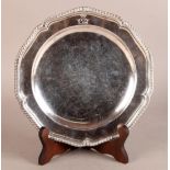 A GEORGE III SILVER DINNER PLATE, London 1763 by Thomas Fleming, of circular bracketed outline