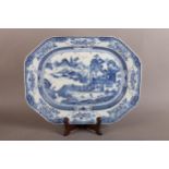 A CHINESE PORCELAIN OCTAGONAL MEAT PLATE decorated in underglaze blue with a formal dwelling on