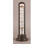 AN EARLY 20TH CENTURY NEGRETTI & ZAMBRA THERMOMETER white enamelled glass register on ebonised