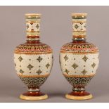 A PAIR OF 19TH CENTURY METTLACH POTTERY VASES, of baluster form, the pale green mat body decorated