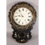 A VICTORIAN BLACK PAPIER MACHE DROP CASED WALL CLOCK, the shaped circular top inlaid with mother-