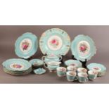 A ROYAL CROWN DERBY TEA SERVICE FOR SIX painted with floral sprays by F.Garnett, turquoise broad