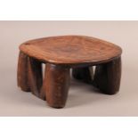 AN AFRICAN TRIBAL NECK REST OR PILLOW, the oval top carved and engraved with a central geometric