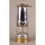 A CHROMIUM PLATED AND BRASS MINER'S LAMP by Davis, Derby, no. 133, 25cm high