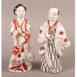 A PAIR OF ARITA PORCELAIN FIGURES, decorated in typical palette, 17cm high, late 18th/early 19th