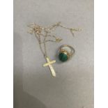 A malachite dress ring in 9ct gold, the oval cabochon collet set within a twisted wire surround,