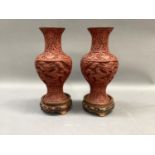 A pair of 20th century Cinnebar style vases of baluster form with flared neck and foot together with
