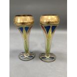 A pair of gilded and enamelled clear glass vases of art nouveau style on circular foot, 17cm high