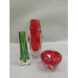 Three 1970s pieces of coloured glassware including a ruby and tinted clear glass cased vase of